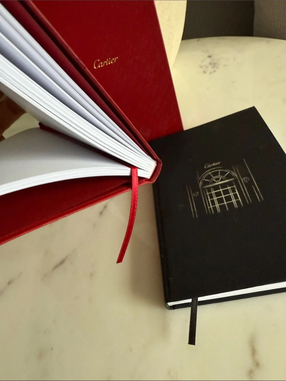 Cartier Red and Black Hardcover Notebooks with Gold Accents